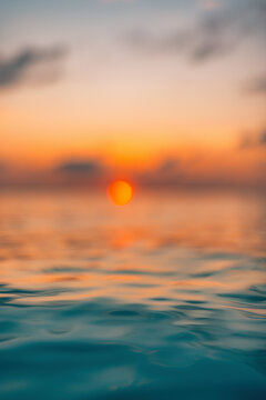 Radiant tranquil sunset ocean closeup with colorful reflections calm water surface serene relaxing seascape nature background. Serene waves ripples peaceful sunlight