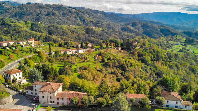 Beautiful aerial view of Barga, nestled in the Garfagnana valley, bathed in sunlight