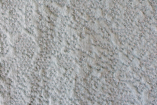 Light knitted fabric texture with metallic silver thread
