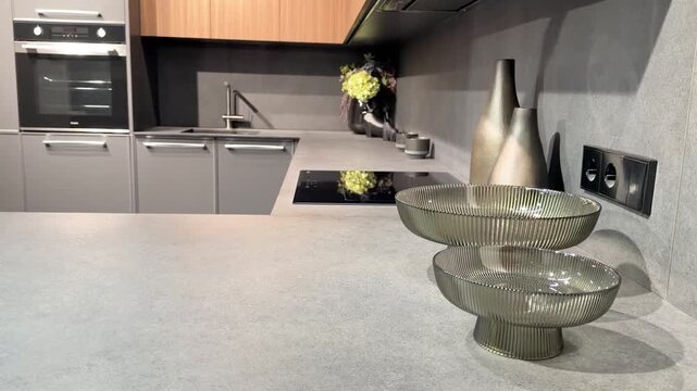 Modern kitchen design featuring stylish dishes arranged on a sleek countertop surface