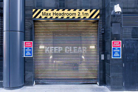  Height restriction sign at building delivery entrance