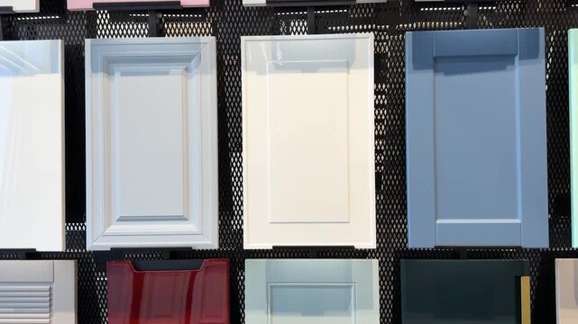 Colorful kitchen cabinet samples arranged neatly for interior design inspiration and selection