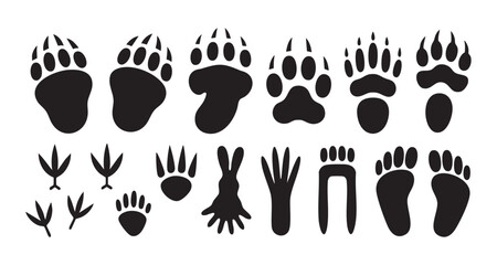 Fototapeta premium Animal paw prints and footprints collection of various wildlife tracks including bears birds and rabbits