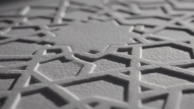 Detailed macro shot of an elegant embossed white paper featuring intricate Islamic geometric patterns and traditional arabesque designs.