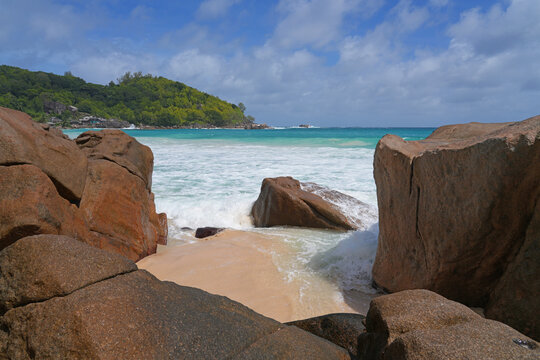Granite boulders on a deserted tropical beach in Mahe, Seychelles, on the Indian Ocean