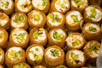 Baklava turkish delight shaped like a nest with pistachios