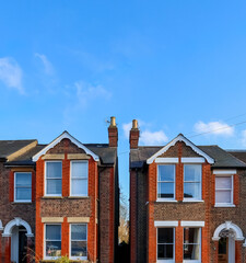 Victorian terraced houses in Hemel Hempstead, England, showing classic brick architecture and blue sky