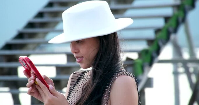 Set of videos showing Vietnamese woman in black bikini and mesh pareo posing, walking, and enjoying Phu Quoc beach, perfect for lifestyle and travel ads.