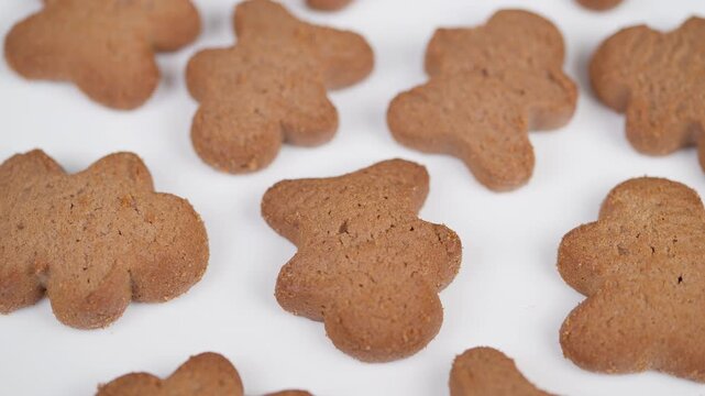 Closeup of festive gingerbread treats with floral shapes. Closeup shot featuring decorated gingerbread cookies and cozy holiday atmosphere for packaging and recipe visuals