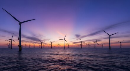 Wind turbines in ocean at sunset, renewable energy concept