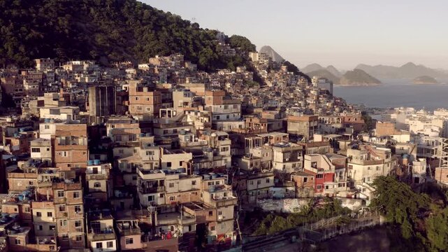 Aerial, drone view of favelas between Ipanema and Copacabana during sunset in Rio de Janeiro.