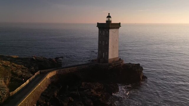 Sunset over the lighthouse at Kermorvan on the Brittany coastline near Brest. Landscape and travel video