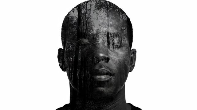 Black and white double exposure of an african man's face combined with a forest. Conceptual sequence showing a fading effect for mental health or mindfulness concepts
