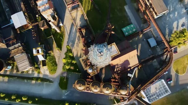 Industrial Drone Landscape. Sunlit Aerial Image Capturing Industrial Heritage And Urban Development