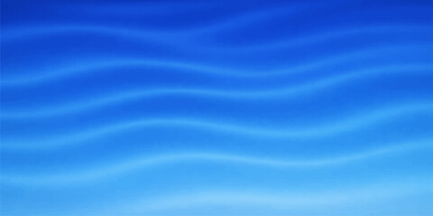 Obraz premium A soft flowing blue silk and satin fabric background with wavy liquid textures and smooth light motion curves creates a 3d wallpaper design