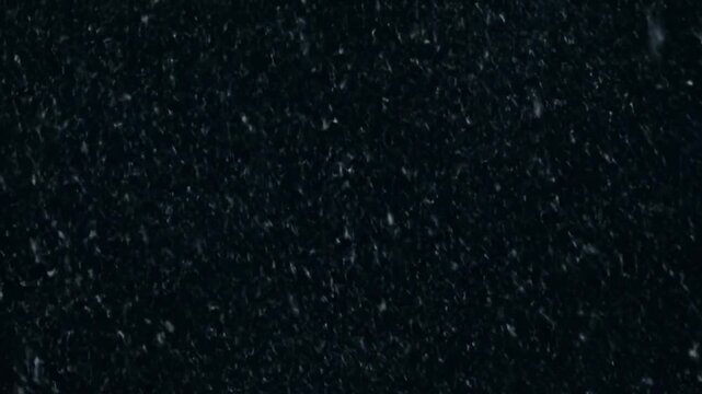 Black granite stone texture background in dark gray and white speckles for interior design