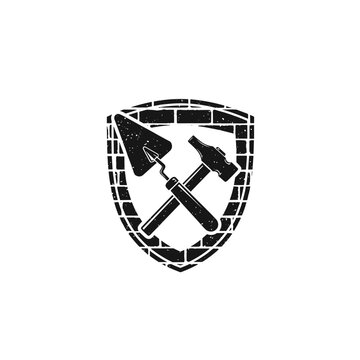 Shield with crossed hammer and chisel.
