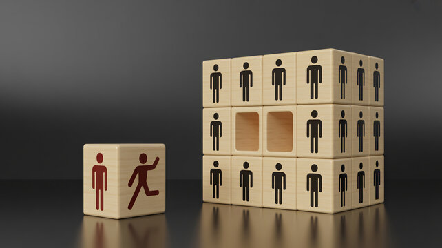 A wooden block with a running stick figure departing from a larger stack of blocks, symbolizing employee turnover and personnel changes.