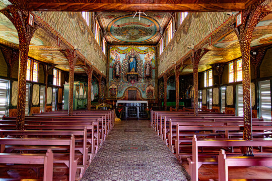 Interior of Saint-Joseph d'Iracoubo church, French Guiana. Famous hand-painted frescoes by a convict, unique wooden architecture in South America.