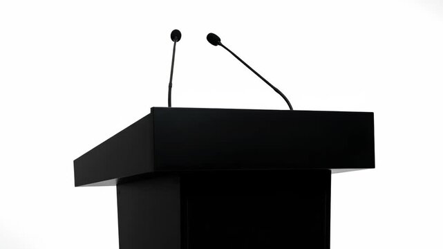 A modern black lectern with microphones ready for a presentation or speech. Empty speaker podium isolated on a white background for a conference, seminar or political event