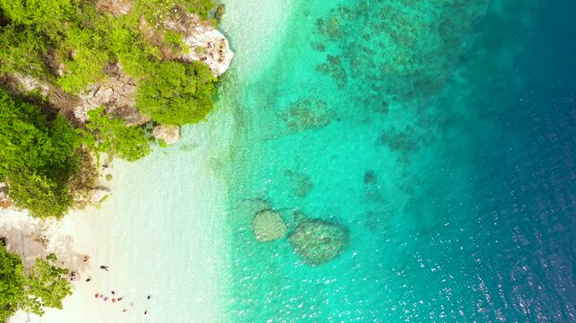 Tropical sandy beach and clear turquoise water. Canibad beach, Island Garden City of Samal, Davao.