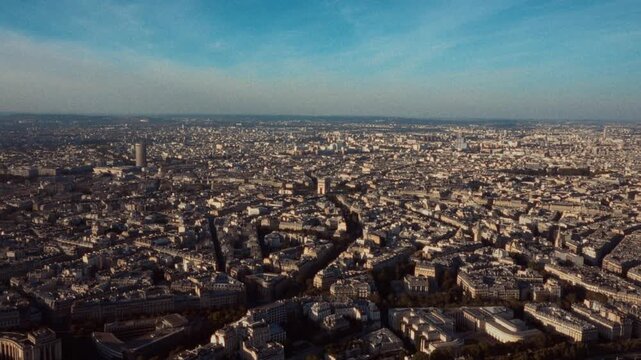 Showcasing Parisian nostalgia with an aerial view of Paris France The retro Super8 film look and blurry handheld effect create a vintage feel travel and documentary content The cityscape b-roll captur
