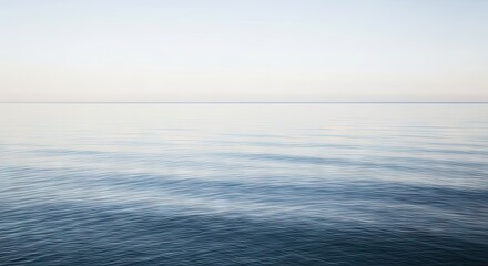 Obraz premium Serene Body of Water Under a Clear Sky Perfect for Nature and Travel Themes