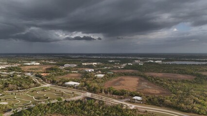 aerial of storm clouds on the horizon over southern Lakewood Ranch, Florida by the industrial park