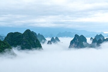 Mountain peaks emerging from fog