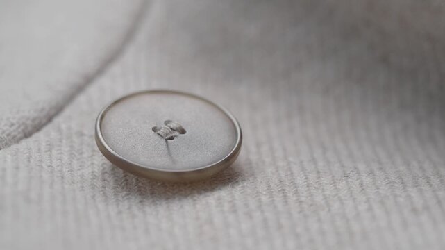 Close up view of a button on a piece of fabric