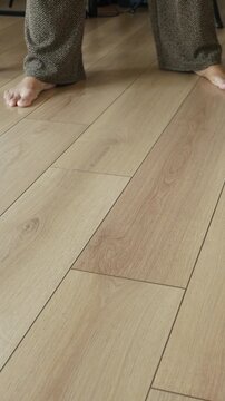 Cleaning the floor with a mop in a home setting