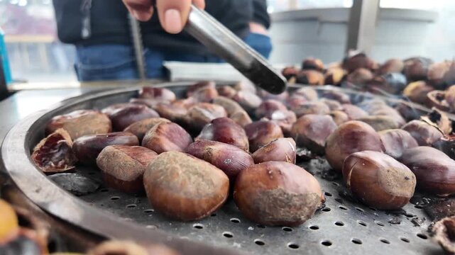 Roasting chestnuts at a market during winter time