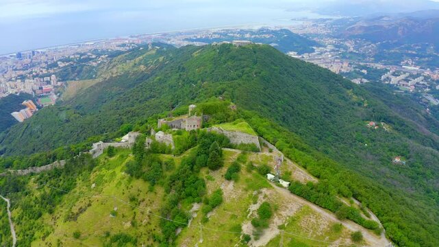Genoa, Italy. Forte Sperone is a key point of the 19th-century Genoese fortifications and is located on top of the Mura Nuove. View of Genoa. Drone footage, Departure of the camera