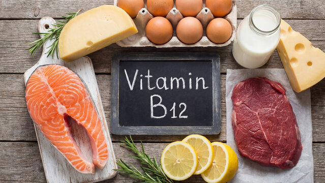 Vitamin B12 rich natural food sources flat lay with salmon eggs cheese beef and milk for nutritional health dietary guidance deficiency prevention and balanced diet education