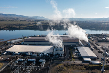 Aerial drone picture of a large data center campus with cooling steam, electrical substation along...