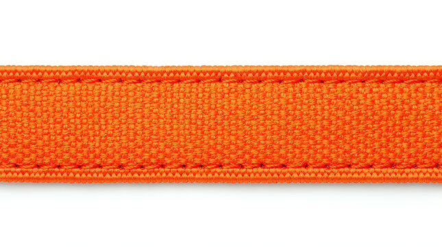 Close-up of a bright orange woven fabric strap with detailed stitching on a white background