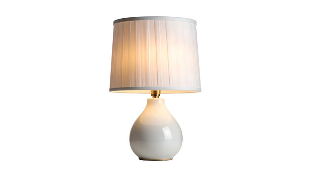 A modern table lamp featuring a white, teardrop-shaped base. A gold accent holds a pleated white shade illuminated with warm light