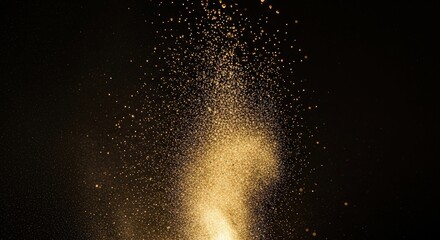 Fototapeta premium Golden particles shimmering and falling against a dark background, creating a dynamic and ethereal effect with a warm glow.