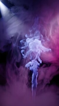 Thick smoke rises in dark setting under bright lights, creating interesting shapes and patterns