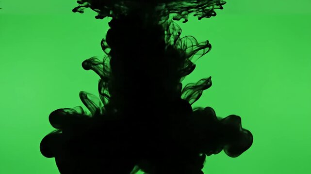 Fluid Dynamics Art with cloud of black paint mixing into water over green screen slowly filling the view distortion, overlay, glitch, static noise, scan lines on background, 4k animated video loop