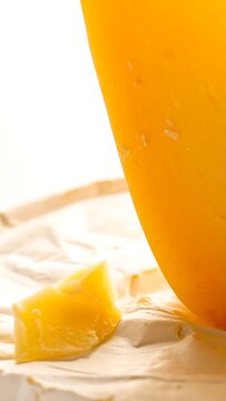 A close-up of a vibrant yellow object on a beige surface