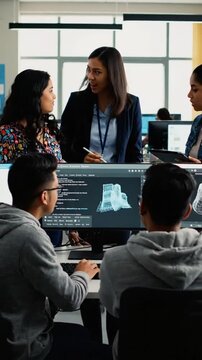 Students work together on 3D modeling in a design workshop at a university in the afternoon