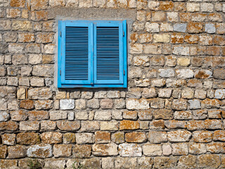 Blue Wooden Shutters on Old Stone Wall in Dobrogea