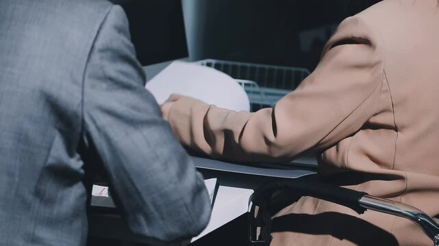 Accountant reviewing printed financial reports at messy office desk with calculator and sticky notes under soft window daylight for audit and corporate finance work