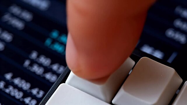 Closeup of keyboard arrow key with financial data