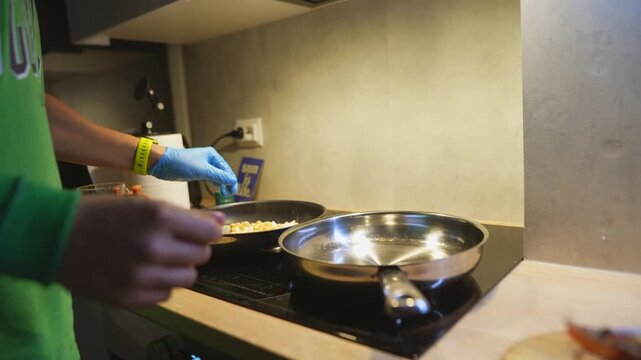 Stirring eggs with care. Warm kitchen scenes with lively activity