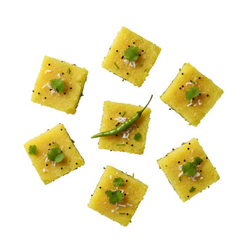 Gujarati Dhokla Steamed Snack Pieces with Mustard Seeds Isolated PNG