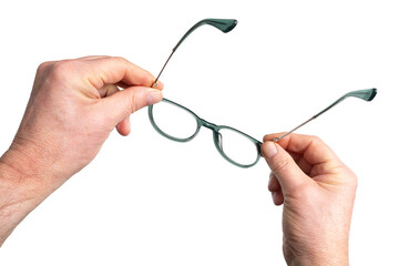 a pair of eyeglasses in hand