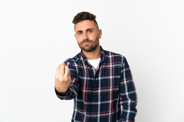 Naklejka premium Caucasian man isolated on white background making Italian gesture