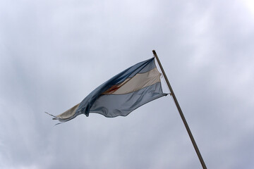 Argentinian flag waving at Iguazu National Park on a cloudy spring day. Photo taken October 7th, 2025, Iguazu National Park, Argentina.